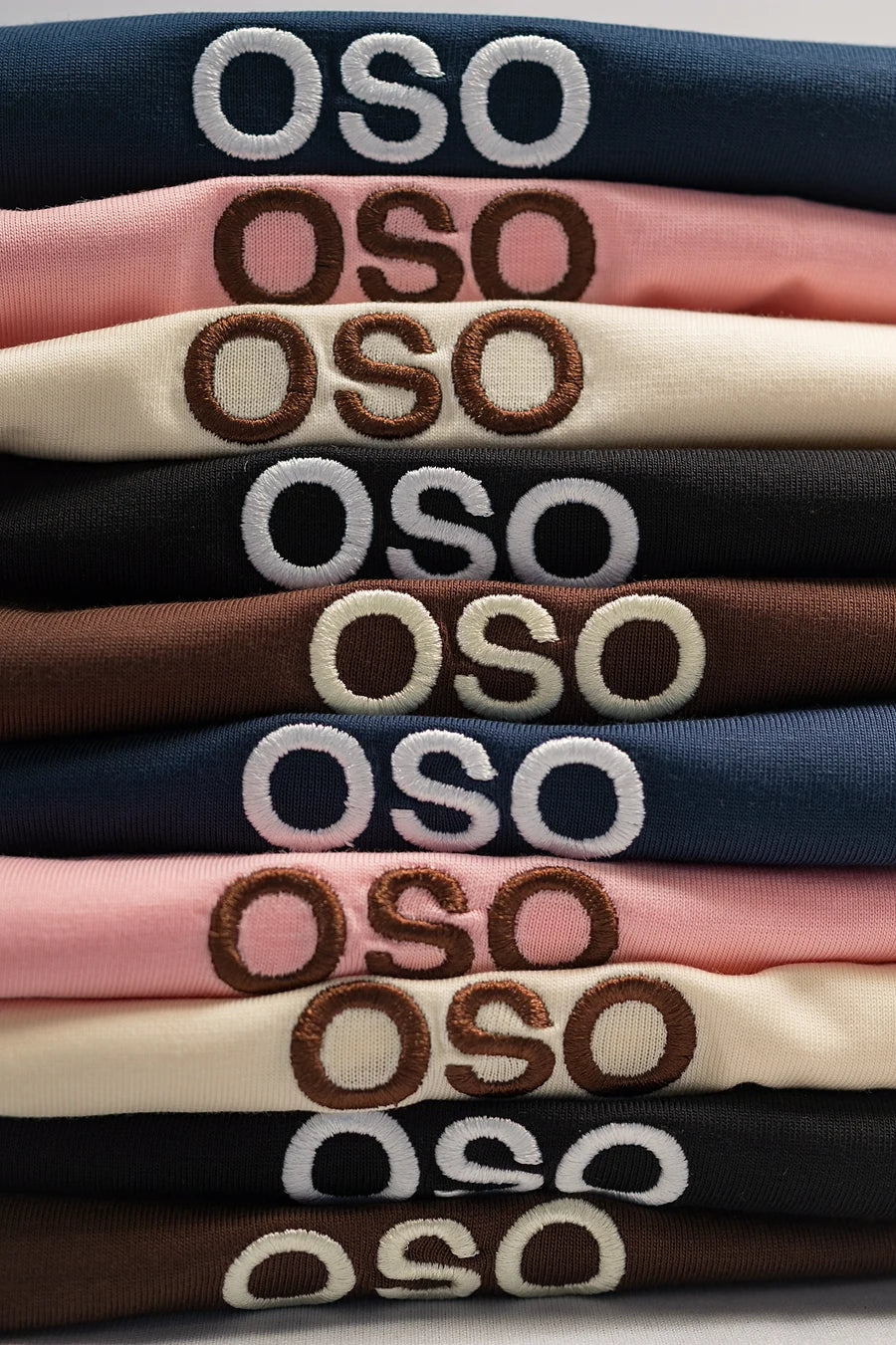 A stack of folded OSO Signature tees